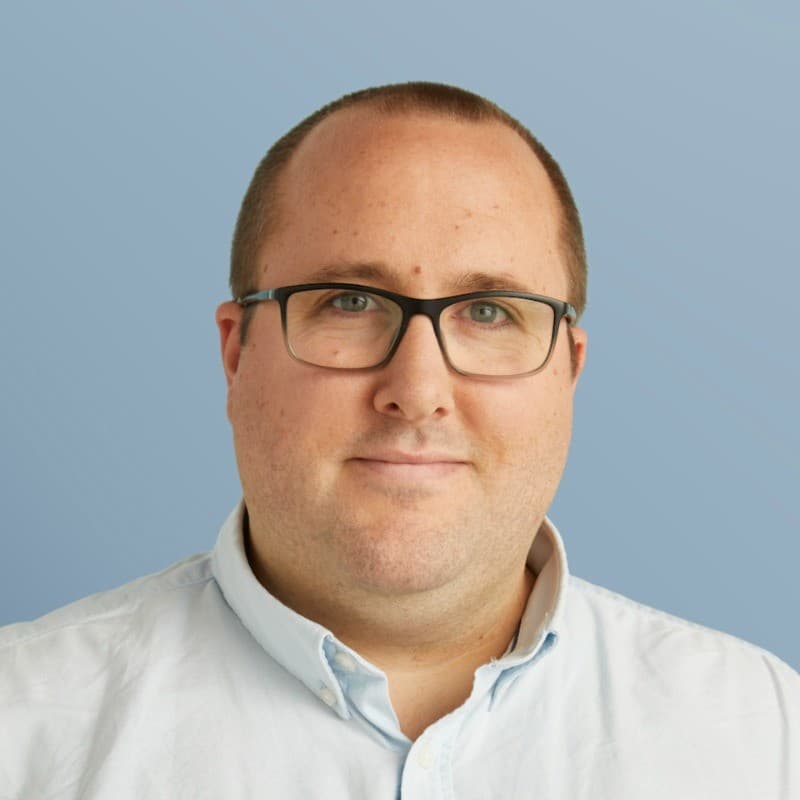 Nick Faulkner smiling in a portrait.