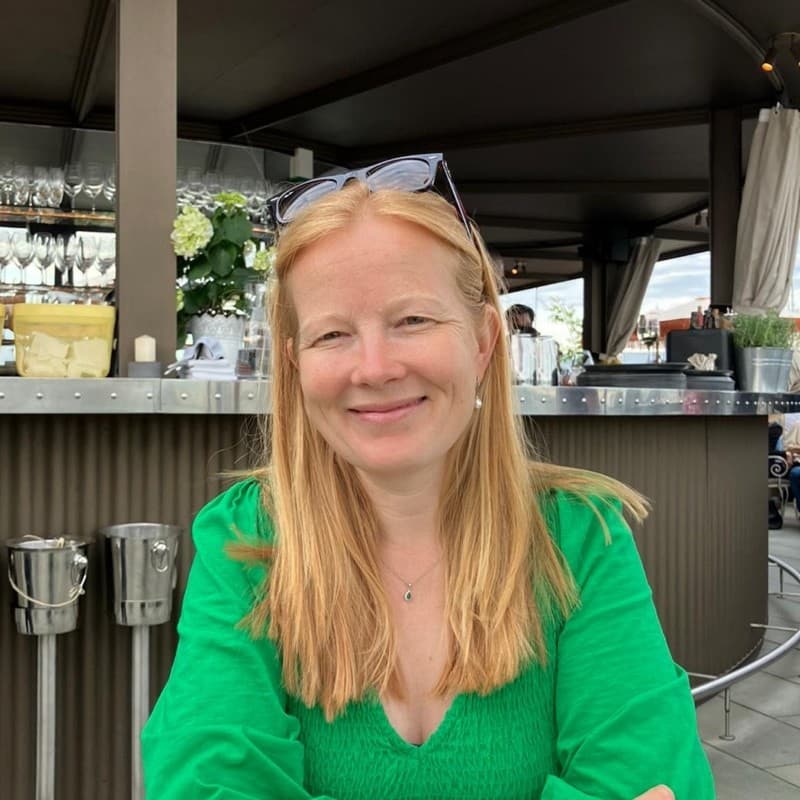Sally Matthews in a navy checked blazer with a pearl necklace.